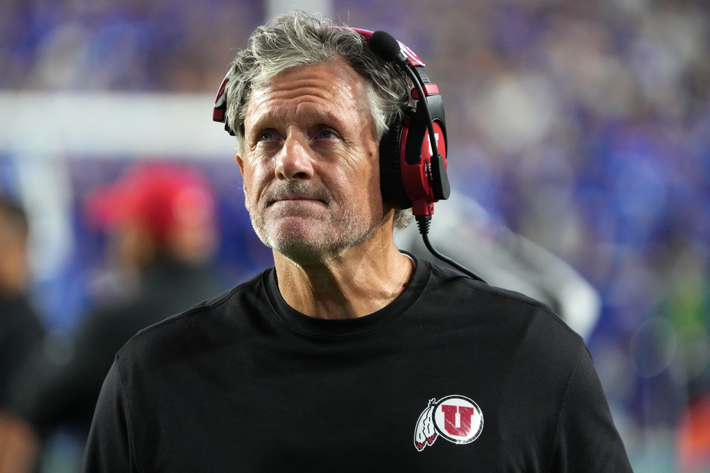 Utah head coach Kyle Whittingham looks at the scoreboard during the first half of an NCAA college football game, against BYU, Saturday, Oct. 18, 2025, in Provo, Utah. (AP Photo/George Frey)