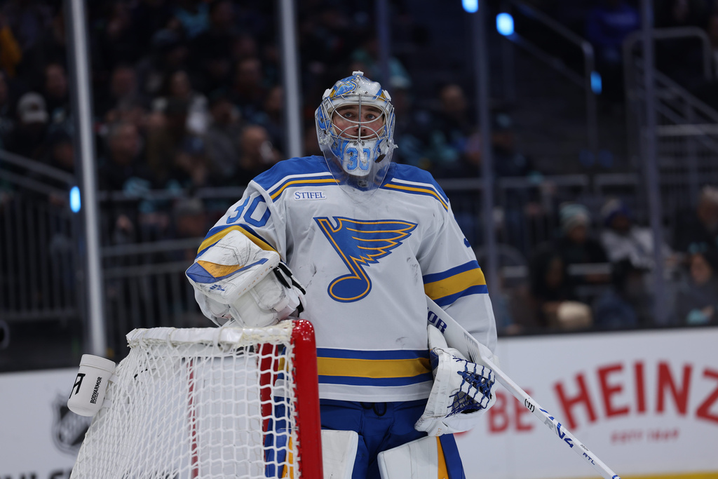 St. Louis Blues goaltender Joel Hofer looks on during an NHL hockey game against the Seattle Kraken, Wednesday, March 4, 2026, in Seattle. (AP Photo/Maddy Grassy)