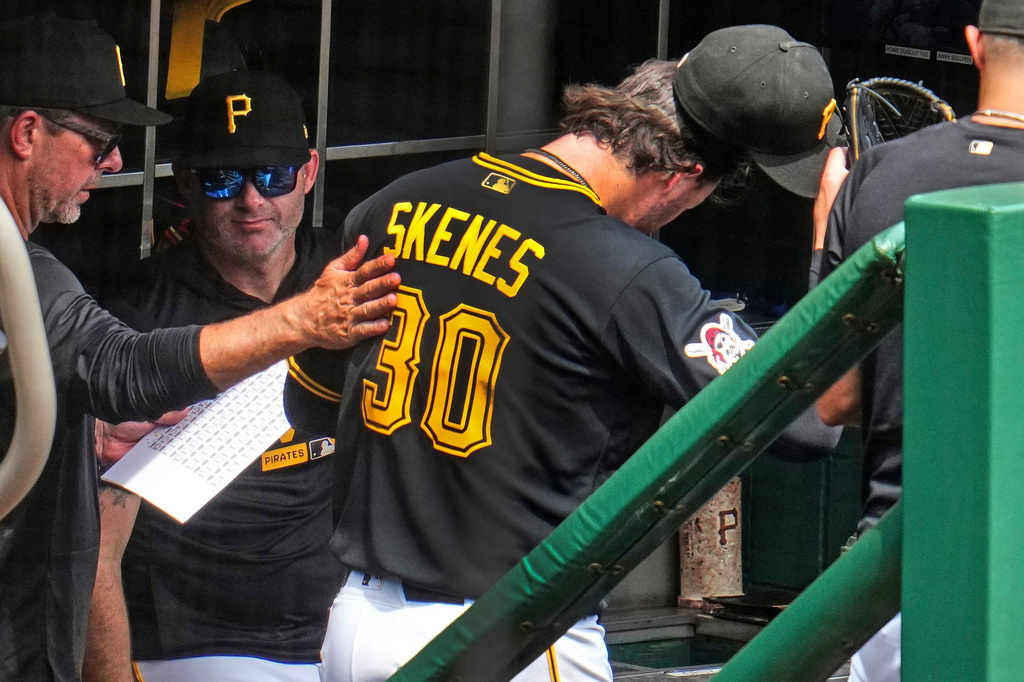 Pittsburgh Pirates pitcher Paul Skenes (30) returns to the dugout after being pulled by manager Don Kelly during the fifth inning of a baseball game against the Detroit Tigers in Pittsburgh, Wednesday, Aug. 19, 2026. (AP Photo/Gene J. Puskar)