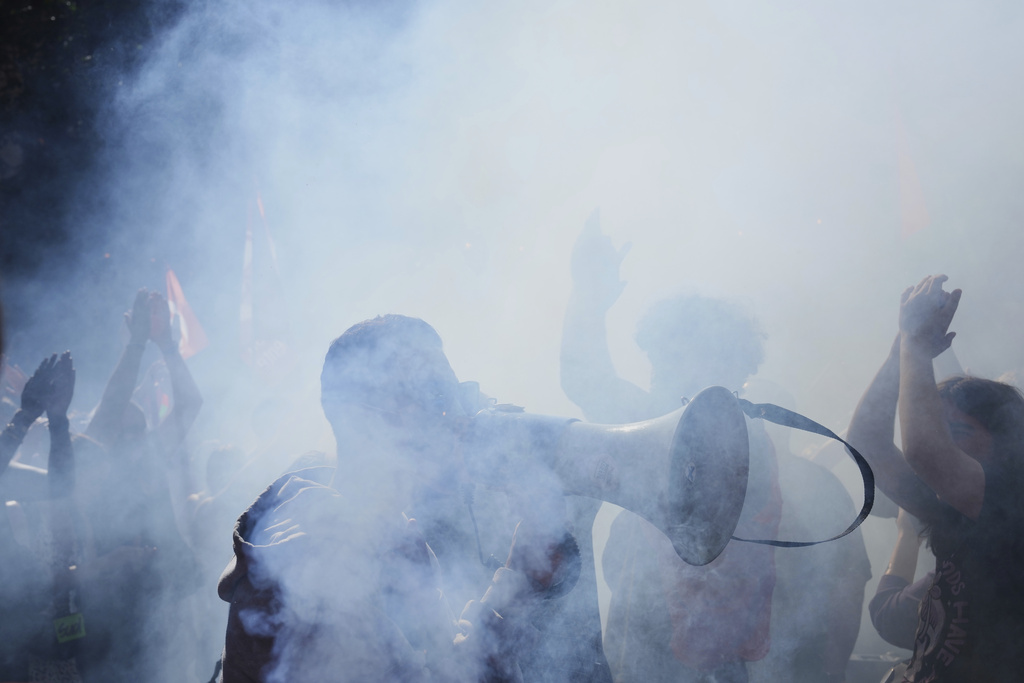 Protesters march during a demonstration called by major trade unions to oppose budget cuts, in Paris, France, Thursday, Sept. 18, 2025. (AP Photo/Aurelien Morissard)