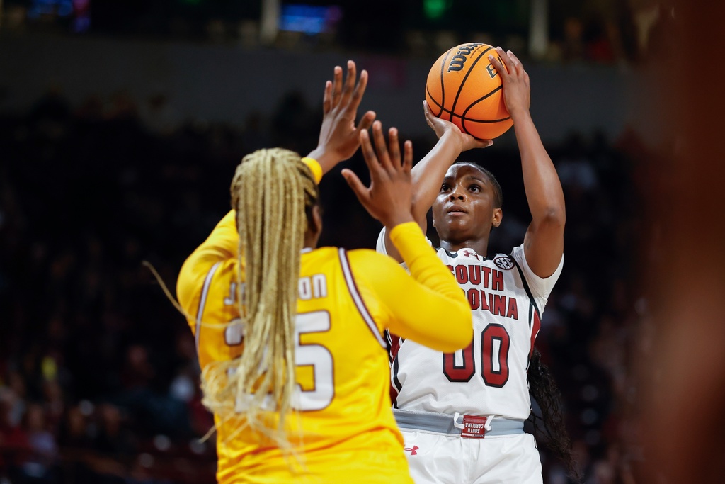 South Carolina guard Ta'Niya Latson (00) shoots against Winthrop forward Tocarra Johnson during the first half of an NCAA college basketball game in Columbia, S.C., Wednesday, Nov. 19, 2025. (AP Photo/Nell Redmond)