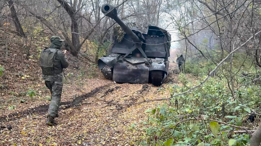 In this image made from video provided by Russian Defense Ministry Press Service on Wednesday, Oct. 29, 2025, a Russian self-propelled howitzer rolls to fire towards Ukrainian positions on an undisclosed location in Ukraine. (Russian Defense Ministry Press Service via AP)
