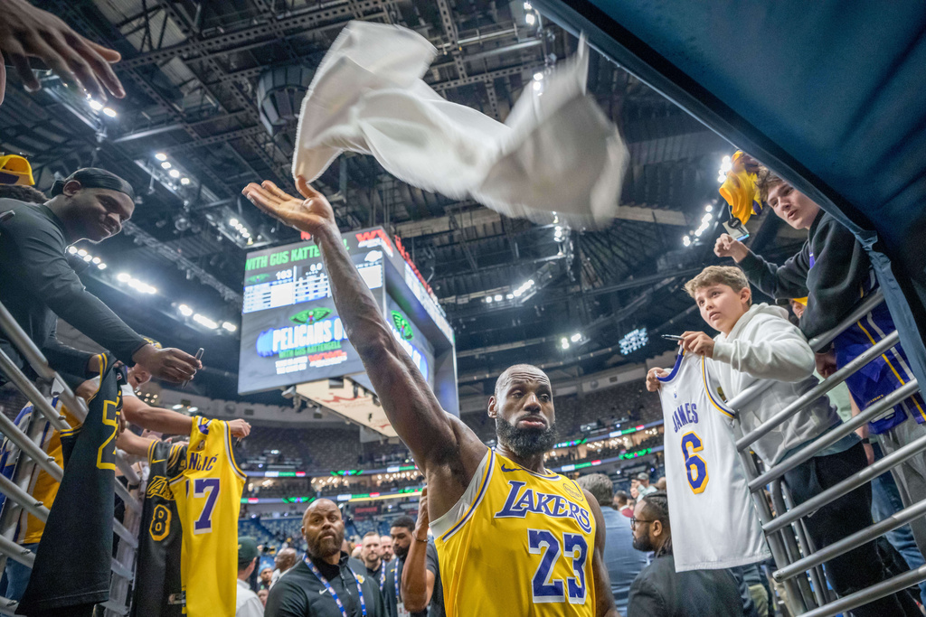 Los Angeles Lakers forward LeBron James (23) tosses his towel after a victory against the New Orleans Pelicans in an NBA basketball game in New Orleans, Tuesday, Jan. 6, 2026. (AP Photo/Matthew Hinton)