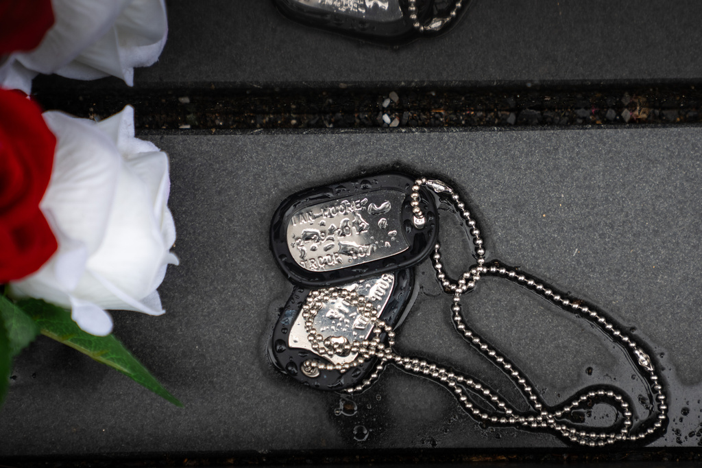 Military dog tags are pictured at the Vietnam Veterans Memorial on Memorial Day, Monday, May 25, 2026, in Washington. (AP Photo/Allison Robbert)