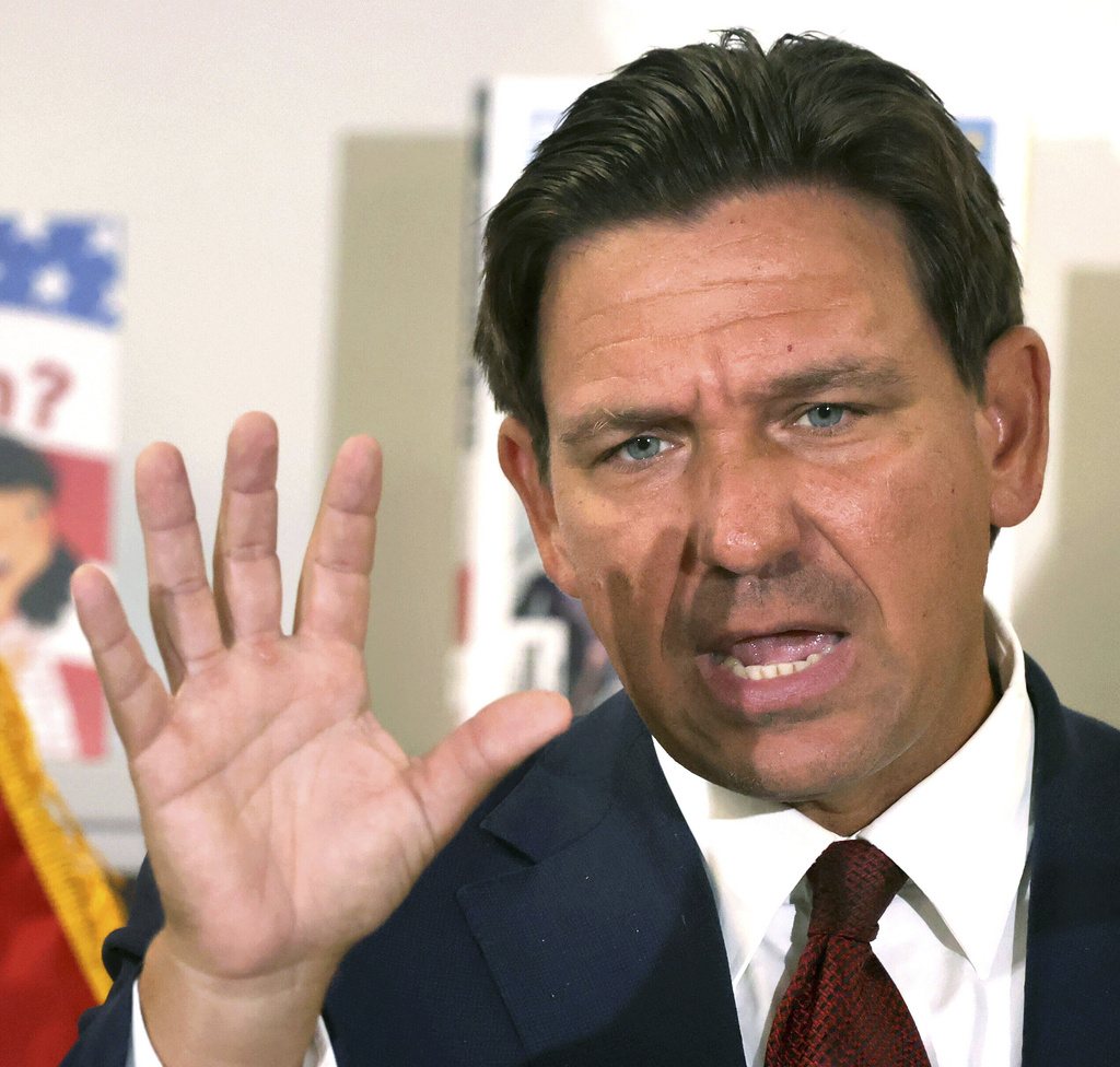 Florida Gov. Ron DeSantis answers a question after announcing a lawsuit against book publishers McGraw Hill, Inc. and Savvas Learning Co., Tuesday, Aug. 19, 2025, with Florida Attorney General James Uthmeier, not pictured, during a press conference at Voyager K-8 School in St. Cloud, Fla. (Joe Burbank/Orlando Sentinel via AP)