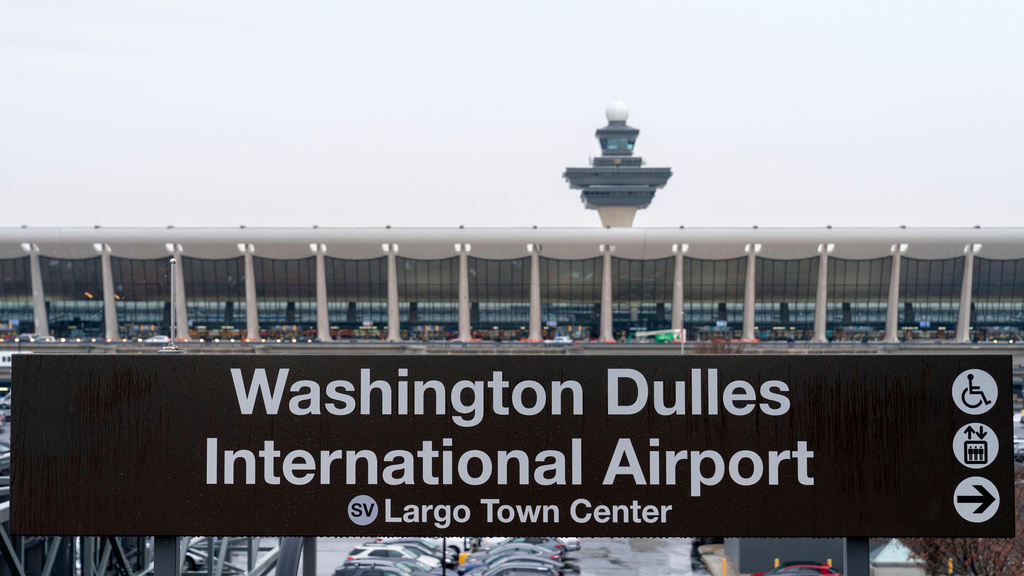 FILE - A sign of Washington Dulles International Airport station is seen during the opening of new Silver Line Extension at Washington Dulles International Airport, in Chantilly, Va., Nov. 15, 2022. (AP Photo/Jose Luis Magana, File)
