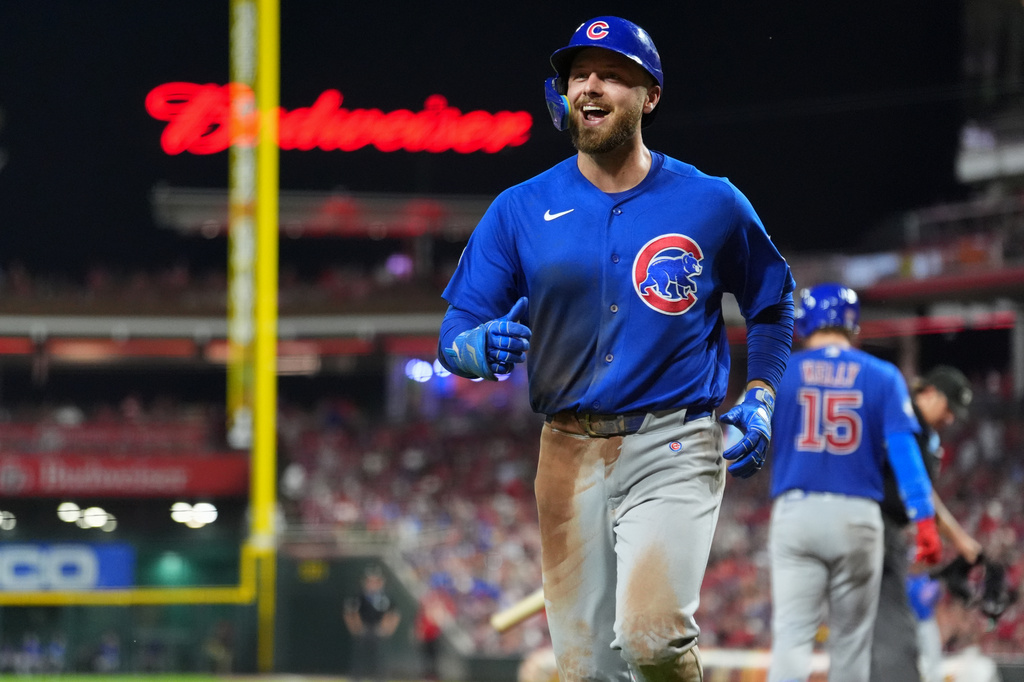Chicago Cubs' Michael Busch smiles after hitting a solo home run during the sixth inning of a baseball game against the Cincinnati Reds, Saturday, Sept. 19, 2026, in Cincinnati. (AP Photo/Kareem Elgazzar)