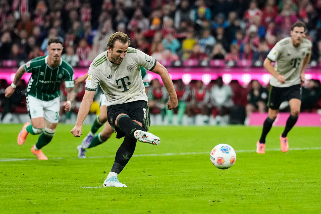 Bayern's Harry Kane scores his side's second goal from a penalty during the Bundesliga soccer match between Bayern Munich and Werder Bremen at the Allianz Arena in Munich, Germany, Friday, Sept. 26, 2025. (AP Photo/Matthias Schrader)