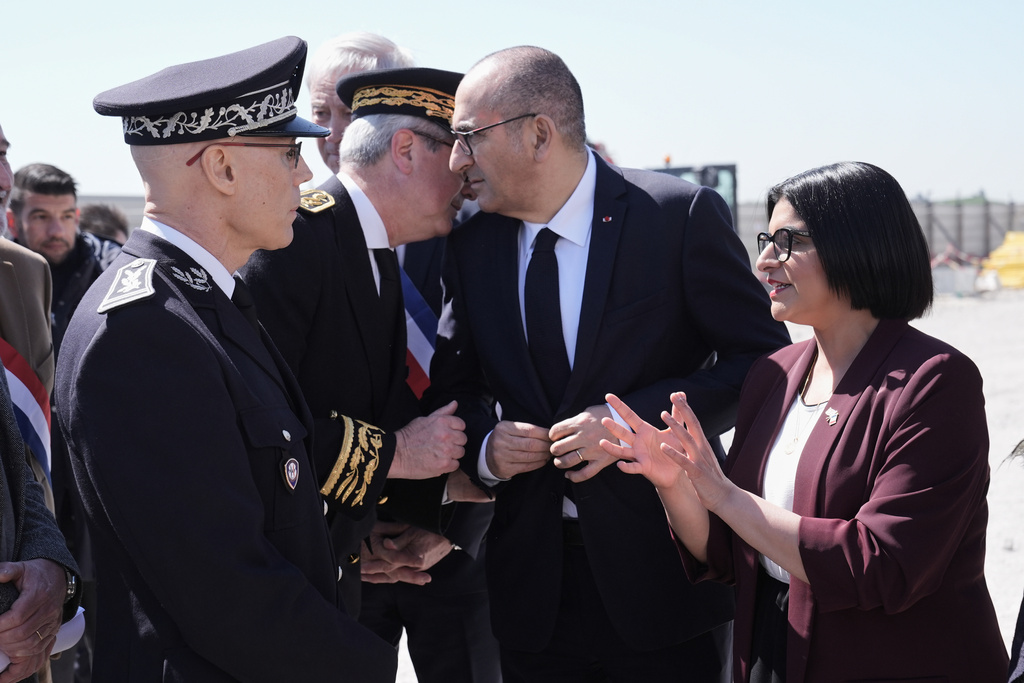 Britain's Home Secretary Shabana Mahmood, right, meets French police officers with France's Interior Minister Laurent Nunez on the site of a new detention centre that is being built in Dunkirk, France, Thursday April 23, 2026. (Stefan Rousseau/Pool Photo via AP)