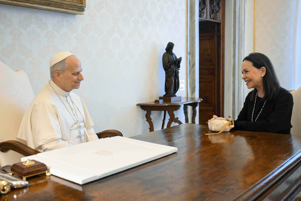 This image released by Vatican Media shows Pope Leo XIV meeting with Nobel Peace Prize laureate María Corina Machado of Venezuela, right, inside his private library at the Vatican, Monday, Jan. 12, 2026. (Vatican Media via AP, HO)