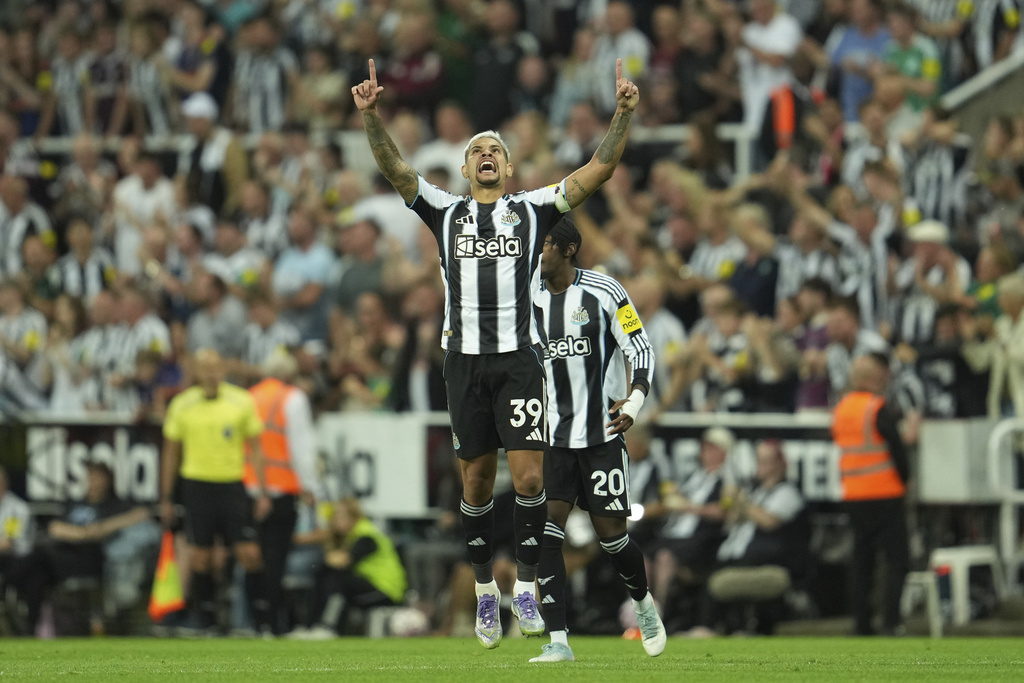 Newcastle's Bruno Guimaraes celebrates after scoring during the Premier League soccer match between Newcastle and Liverpool in Newcastle, England, Monday, Aug. 25, 2025. (AP Photo/Jon Super)