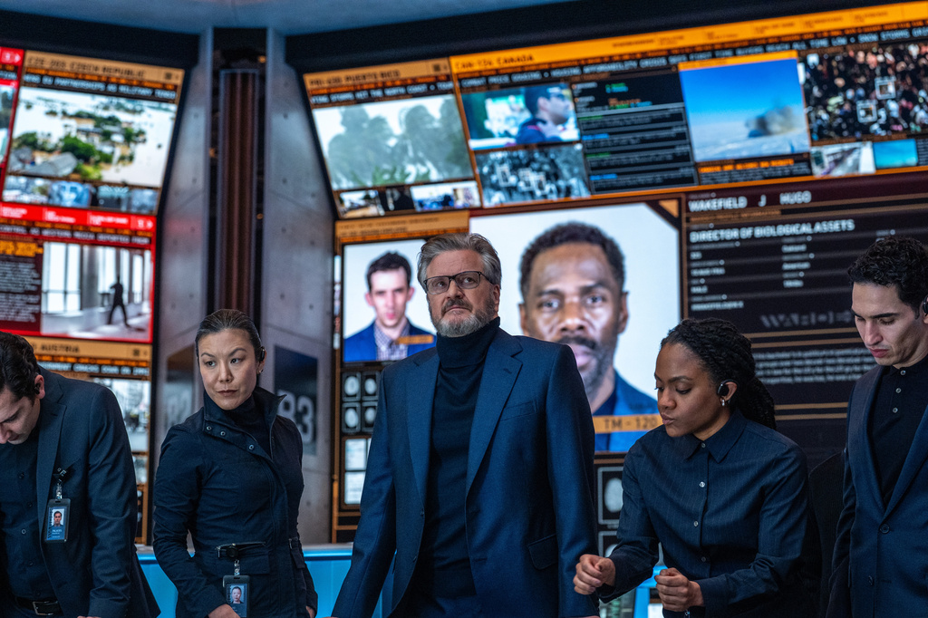 This image released by Universal Pictures shows Colin Firth, center, in a scene from "Disclosure Day." (Niko Tavernise/Universal Pictures and Amblin Entertainment via AP)