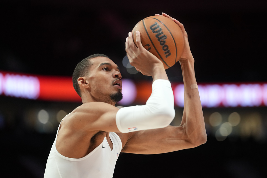 San Antonio Spurs forward/center Victor Wembanyama warms up before Game 4 of a first-round NBA basketball playoffs series against the Portland Trail Blazers in Portland, Ore, Sunday, April 26, 2026. (AP Photo/Jenny Kane)