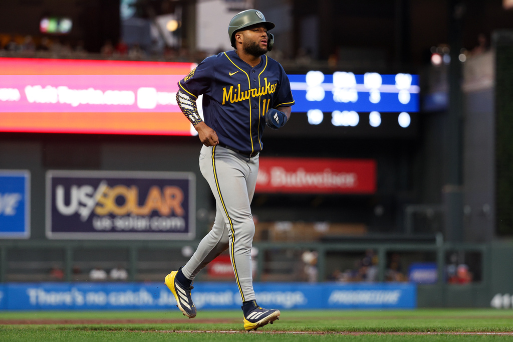 Milwaukee Brewers' Jackson Chourio scores on an interference call by Minnesota Twins third baseman Royce Lewis during the eighth inning of a baseball game, Friday, May 15, 2026, in Minneapolis. (AP Photo/Matt Krohn)