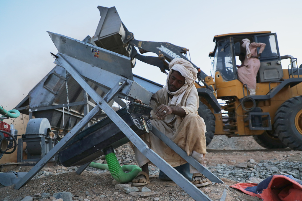 An artisanal miner operates an ore-processing machine used to separate gold-bearing material at a mining site in Dalago Mahas, Sudan's Northern State, Thursday, May 7, 2026.(AP Photo/Mohnd Blal)