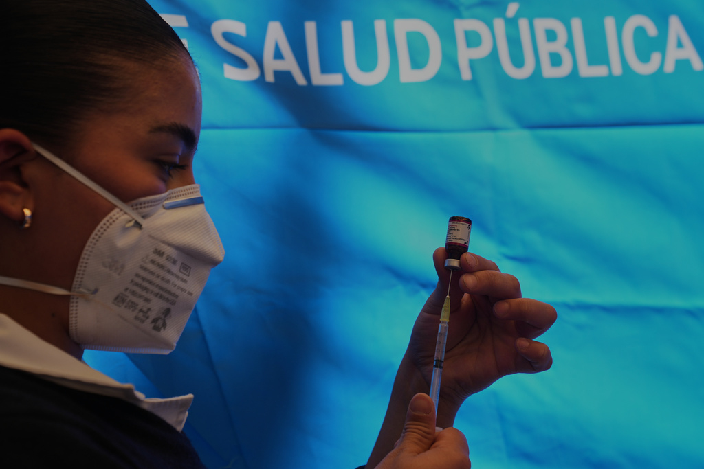 A health worker prepares a dose of the measles vaccine in Chapultepec Park in Mexico City, Sunday, Feb. 8, 2026. (AP Photo/Marco Ugarte)