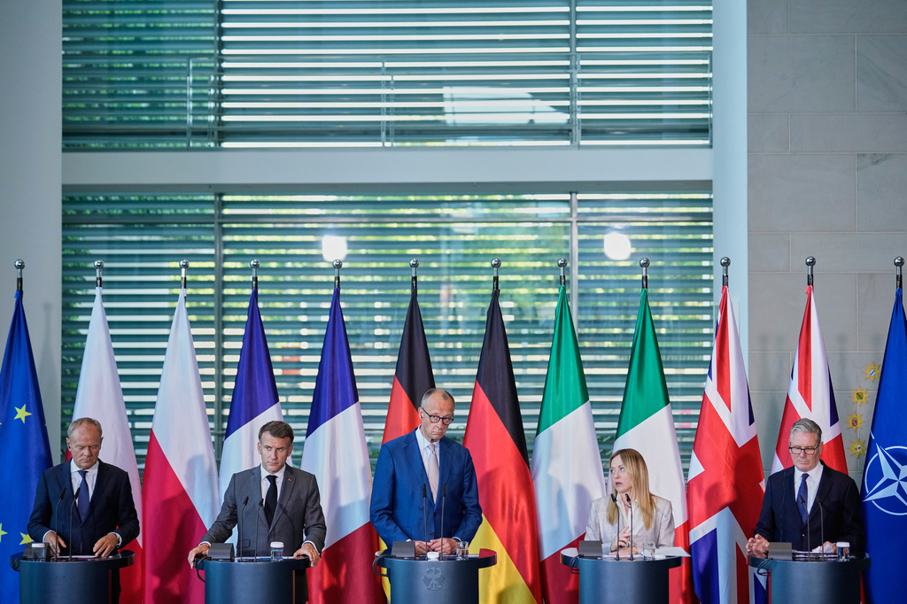 From left to right, Poland's Prime Minister Donald Tusk, French President Emmanuel Macron, German Chancellor Friedrich Merz, Italian Prime Minister Giorgia Meloni and Britain's Prime Minister Keir Starmer attend a press conference at the E5 NATO Summit in Berlin, Germany, Wednesday, June 24, 2026. (AP Photo/Ebrahim Noroozi)