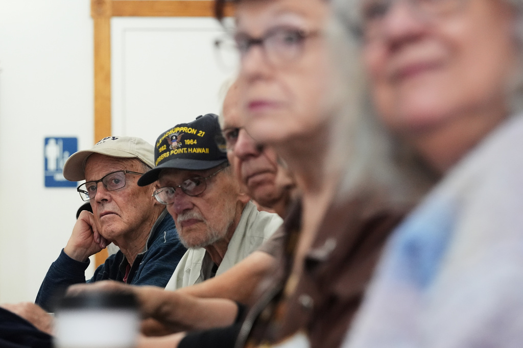 Supporters listen to Democratic congressional candidate Mitchell Berman at Wilson's Coffee and Tea in Racine, Wis., Tuesday, Sept. 22, 2026. (AP Photo/Nam Y. Huh)
