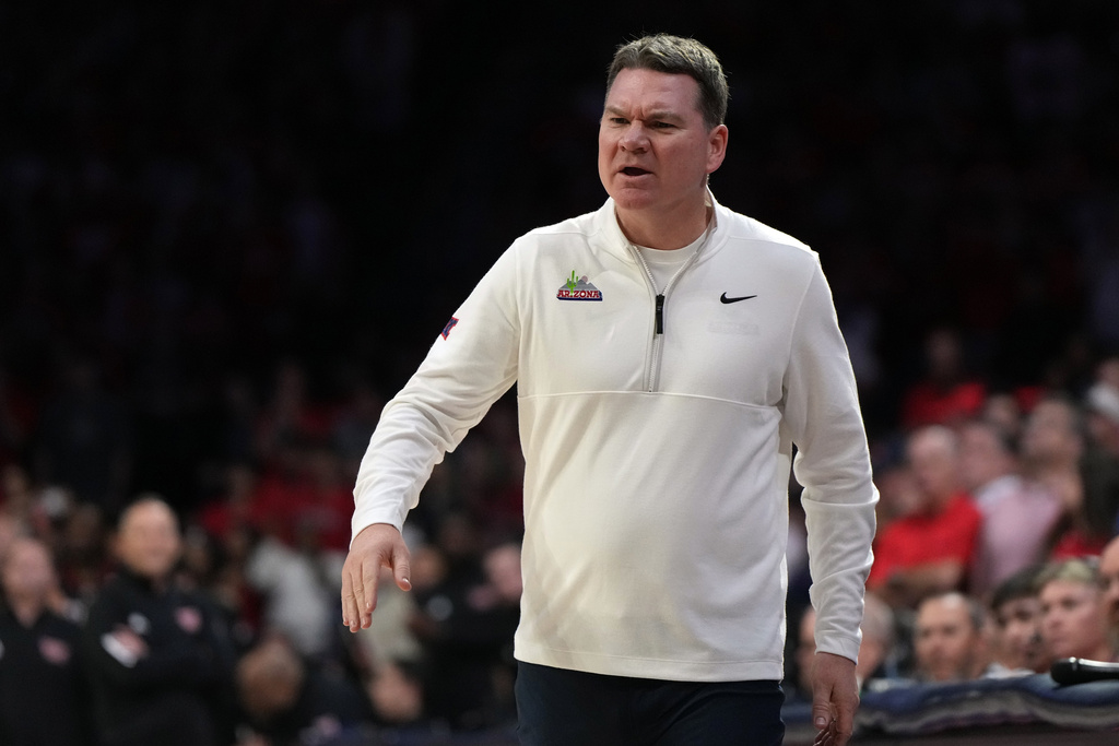Arizona head coach Tommy Lloyd reacts after a foul call against Texas Tech during the first half of an NCAA college basketball game, Saturday, Feb. 14, 2026, in Tucson, Ariz. (AP Photo/Rick Scuteri)