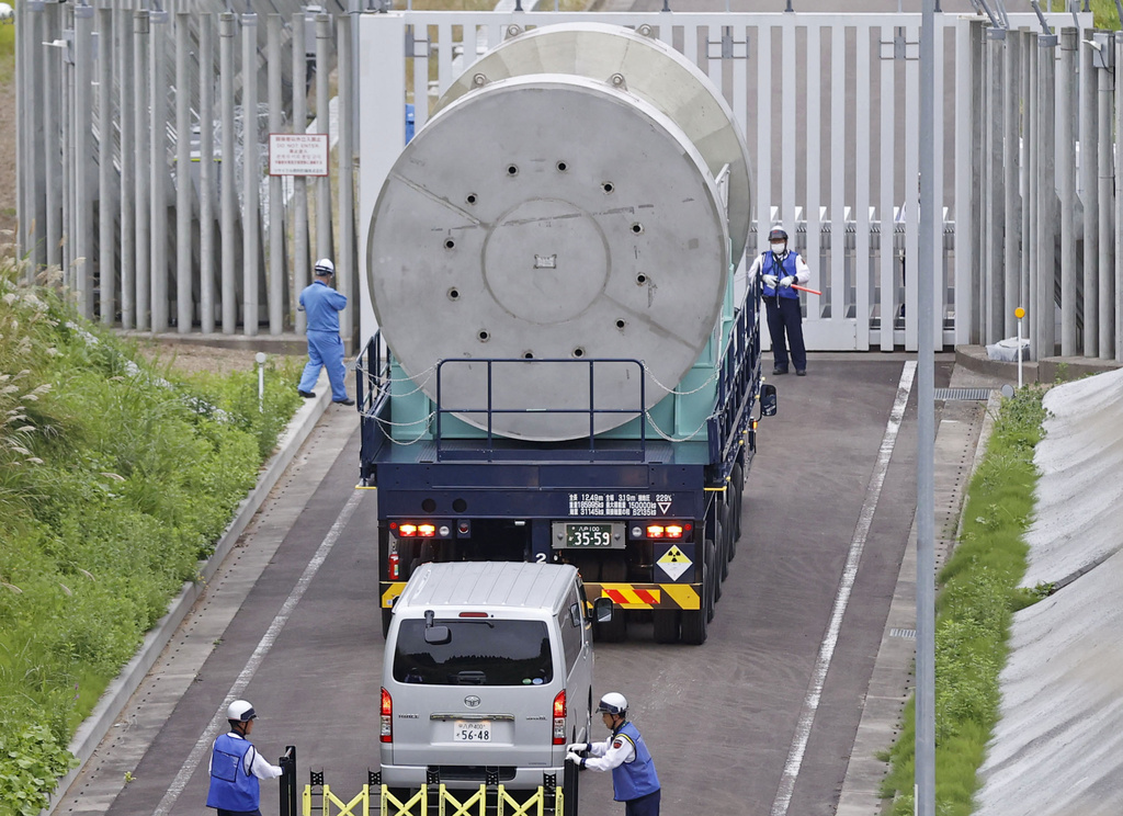 A cask containing spent fuel from Kashiwazaki-Kariwa is transported to an interim storage in Mutsu, Aomori, northern Japan on Sept. 26, 2024. (Kyodo News via AP)