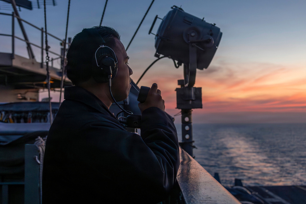 This photo provided by the U.S. Navy shows Seaman Rafael Brito standing watch aboard the Nimitz-class aircraft carrier USS Abraham Lincoln in the Indian Ocean on Jan. 22, 2026. (Mass Communication Specialist Seaman Angel Campbell/U.S. Navy via AP)