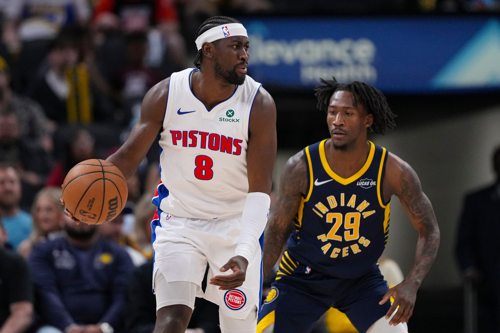 Indiana Pacers guard Quenton Jackson (29) defends Detroit Pistons guard Caris LeVert (8) during the first half of an NBA basketball game in Indianapolis, Sunday, April 12, 2026. (AP Photo/Michael Conroy)