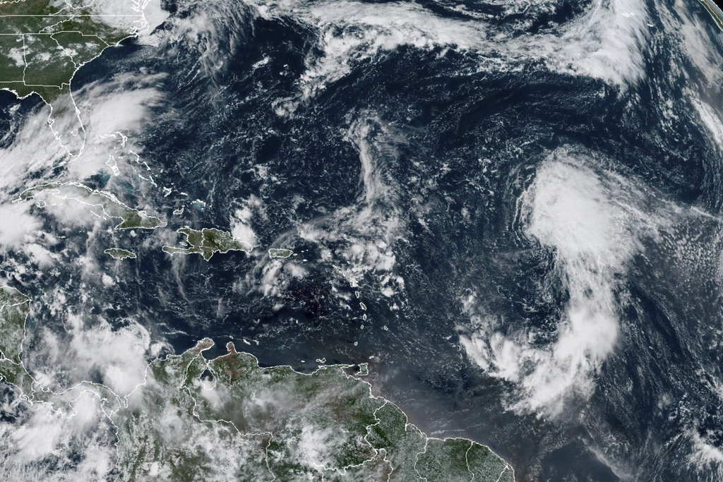 This GOES-19 GeoColor satellite image taken Wednesday, Sept. 17, 2025 at 10:50 a.m. EDT, and provided by NOAA, shows Tropical Storm Gabrielle, right, in the tropical Atlantic Ocean. (NOAA via AP)
