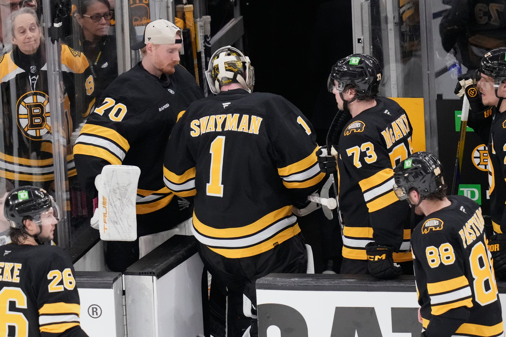 Boston Bruins goaltender Jeremy Swayman (1) heads to the locker room following a loss to the Buffalo Sabres in Game 3 of a first-round NHL hockey Stanley Cup playoff series, Thursday, April 23, 2026, in Boston. (AP Photo/Charles Krupa)