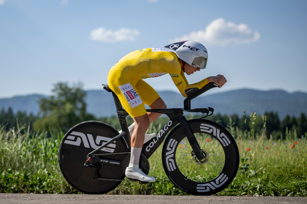 Tadej Pogacar from Slovenia pedals during the fourth stage, a 23,8 km time trial race with start and finish in Aarburg, at the 89th Tour de Suisse UCI World Tour cycling race, Saturday, June 20, 2026. (Gian Ehrenzeller/Keystone via AP)