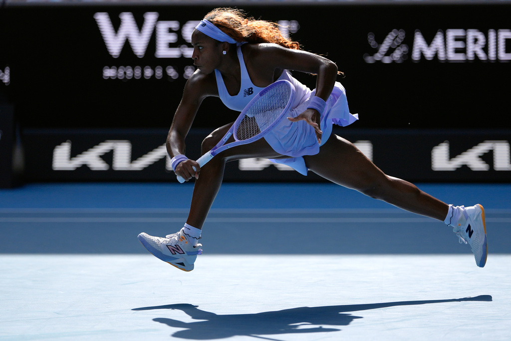 Coco Gauff of the U.S. plays a backhand return to Karolina Muchova of the Czech Republic during their fourth round match at the Australian Open tennis championship in Melbourne, Australia, Sunday, Jan. 25, 2026. (AP Photo/Asanka Brendon Ratnayake)