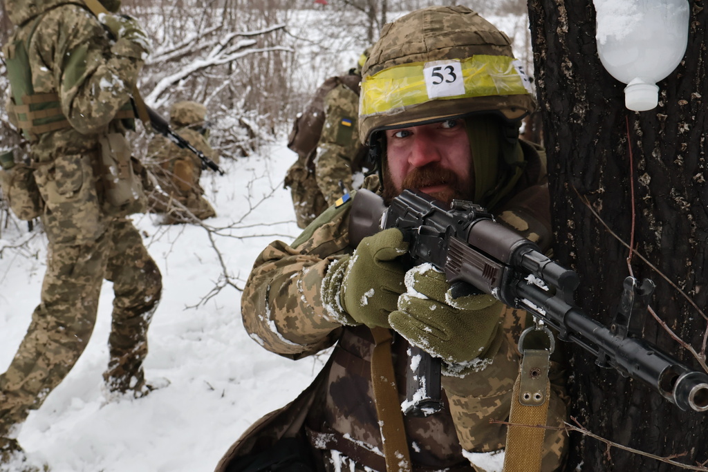In this photo provided by Ukraine's 65th Mechanized Brigade press service, recruits attend drills at a training ground in the Zaporizhzhia region, Ukraine, Monday, Dec. 29, 2025. (Andriy Andriyenko/Ukraine's 65th Mechanized Brigade via AP)