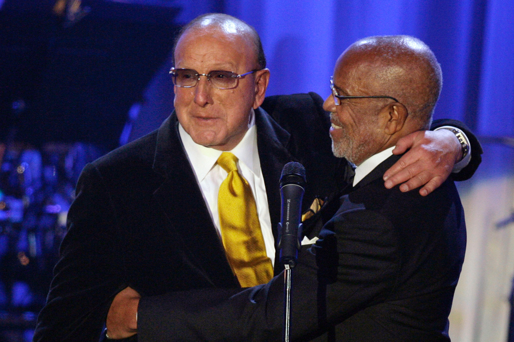 FILE - Music producer Berry Gordy, right, appears with Clive Davis during Davis' Pre-Grammy Party in Beverly Hills, Calif., on Feb. 10, 2007. (AP Photo/Danny Moloshok, File)