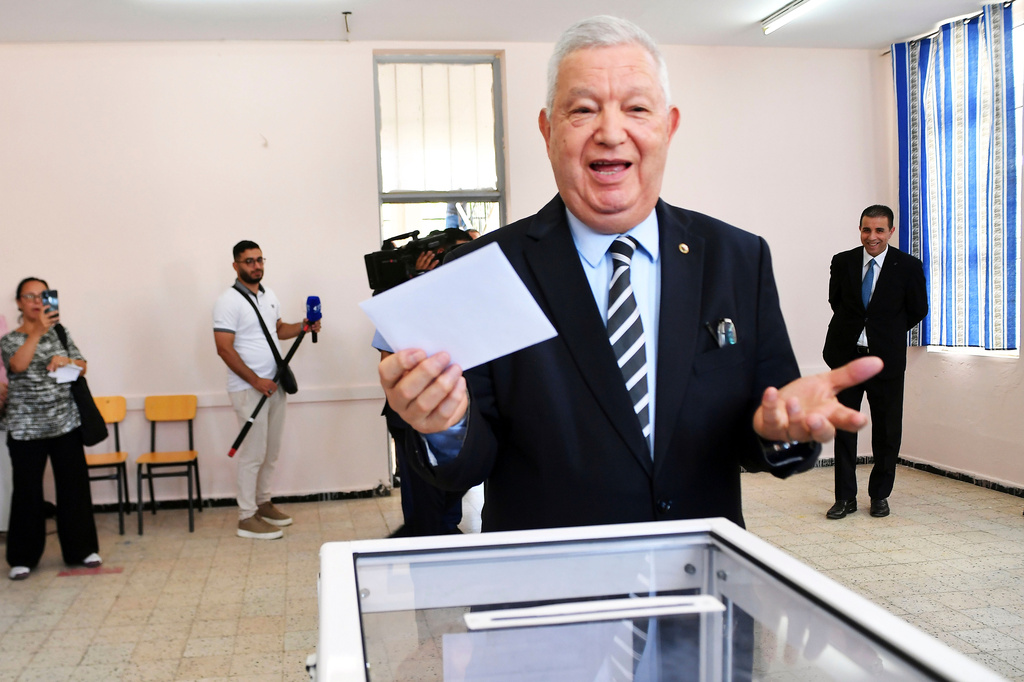 The President of the Council of the Nation, Azouz Nasri, shares a light moment before casting his vote for the parliamentary elections in Algiers, Algeria, Thursday, July 2, 2026. (AP Photo/Fateh Guidoum)