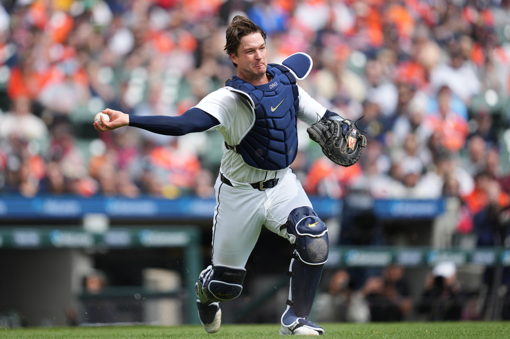 Detroit Tigers catcher Dillon Dingler throws to first base for an out on a St. Louis Cardinals' Victor Scott II bunt in the first inning of a baseball game Saturday, April 4, 2026, in Detroit. (AP Photo/Paul Sancya)