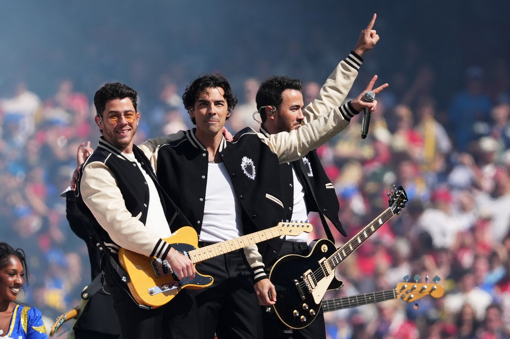 The Jonas Brothers perform during halftime of an NFL football game between the Los Angeles Rams and the San Francisco 49ers, Friday, Sept. 11, 2026, in Melbourne, Australia. (AP Photo/Scott Barbour)