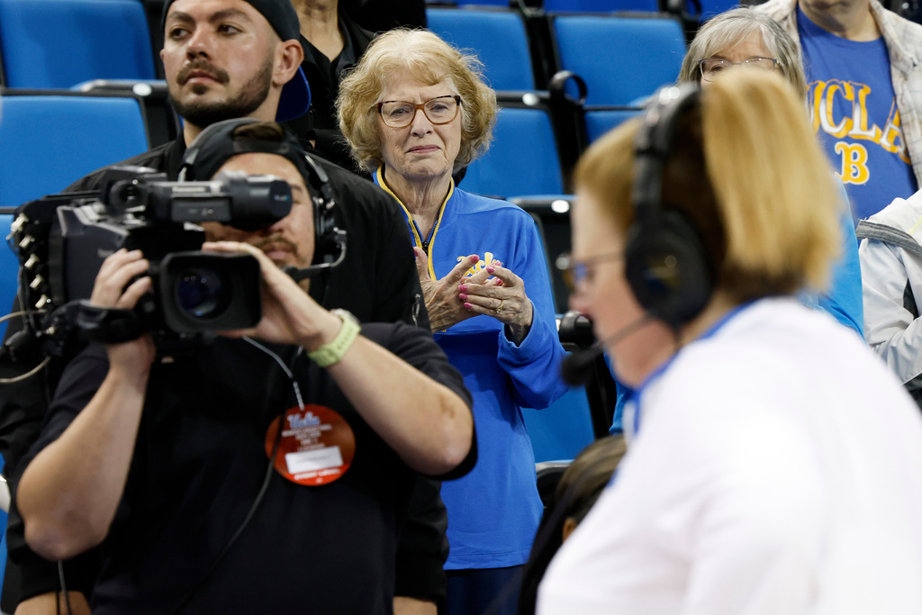 Patti Close watches her daughter, UCLA head coach Cori Close, give a post-game interview after an NCAA college basketball game against Rutgers, Wednesday, Feb. 4, 2026, in Los Angeles. (AP Photo/Caroline Brehman)