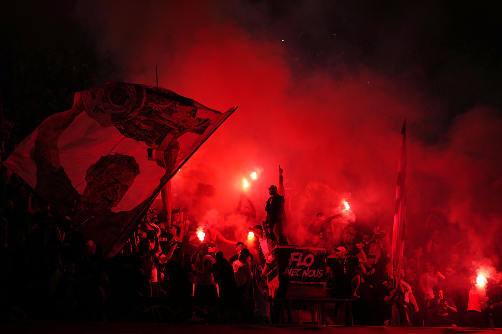 PSG fans light flares on the stands during a Champions League semifinal, first leg, soccer match between Paris Saint-Germain and Bayern Munich in Paris, Tuesday, April 28, 2026. (AP Photo/Aurelien Morissard)