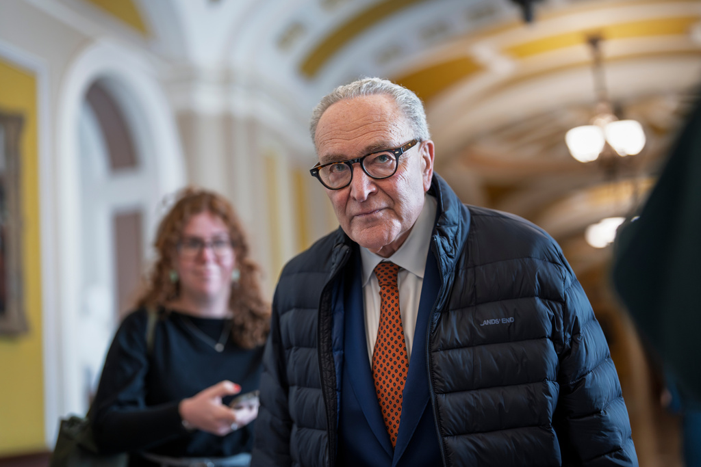 Senate Minority Leader Chuck Schumer, D-N.Y., arrives at his office as the Senate returns at the Capitol in Washington, Tuesday, Jan. 27, 2026. (AP Photo/J. Scott Applewhite)
