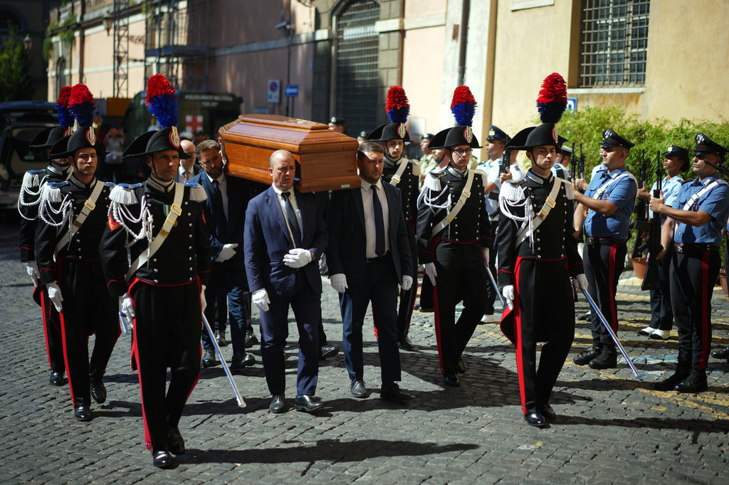 The casket of Emma Bonino, who rose to political prominence in the 1970s campaigning to legalize abortion in heavily Roman Catholic Italy, arrives for two days of lying in state in Rome's City Hall, Sunday, Sept. 13, 2026. (AP Photo/Andrew Medichini)