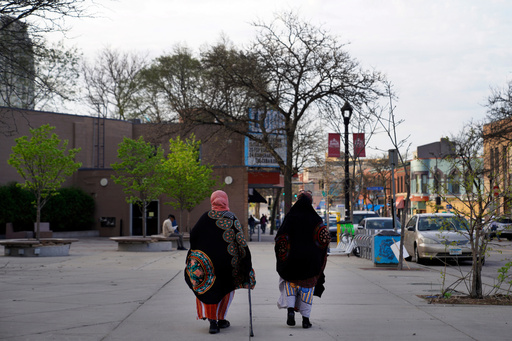 FILE - Women walk down a street in the predominantly Somali neighborhood of Cedar-Riverside in Minneapolis on May 12, 2022. (AP Photo/Jessie Wardarski, File) FILE - Women walk down a street in the predominantly Somali neighborhood of Cedar-Riverside in Minneapolis on May 12, 2022. (AP Photo/Jessie Wardarski, File)