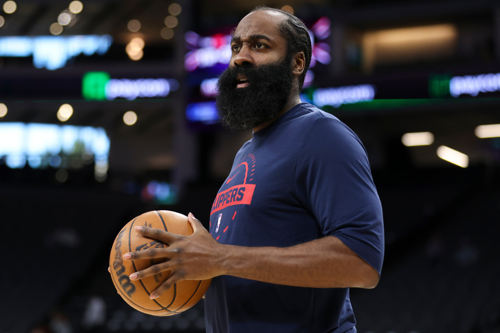 Los Angeles Clippers guard James Harden looks on before an NBA basketball preseason game against the Sacramento Kings, Wednesday, Oct. 15, 2025, in Sacramento, Calif. (AP Photo/Scott Marshall)