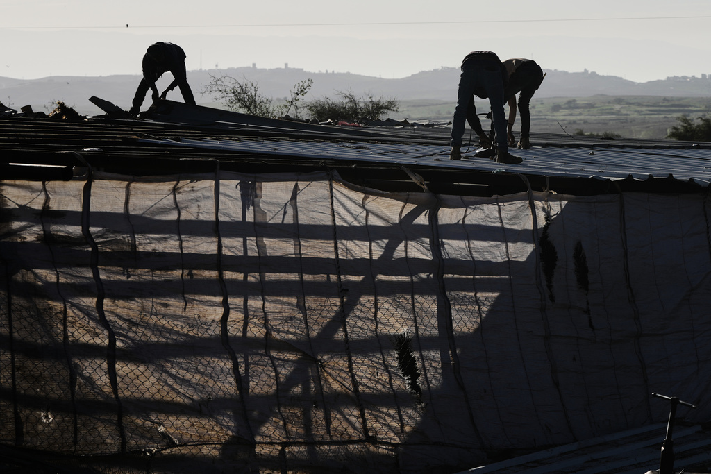 Palestinian residents of Ras Ein al-Auja village, West Bank pack up their belongings and prepare to leave their homes after deciding to flee mounting settler violence, Sunday, Jan. 11, 2026. (AP Photo/Mahmoud Illean)