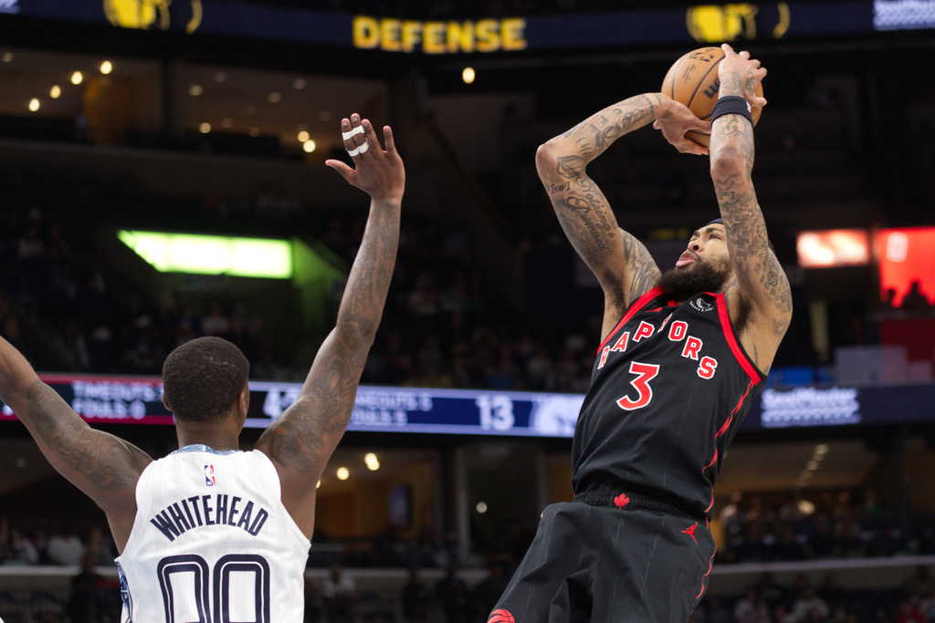 Toronto Raptors forward Brandon Ingram (3) looks to shoot while defended by Memphis Grizzlies forward Dariq Whitehead (00) during the first half of an NBA basketball game Friday, April 3, 2026, in Memphis, Tenn. (AP Photo/Nikki Boertman)