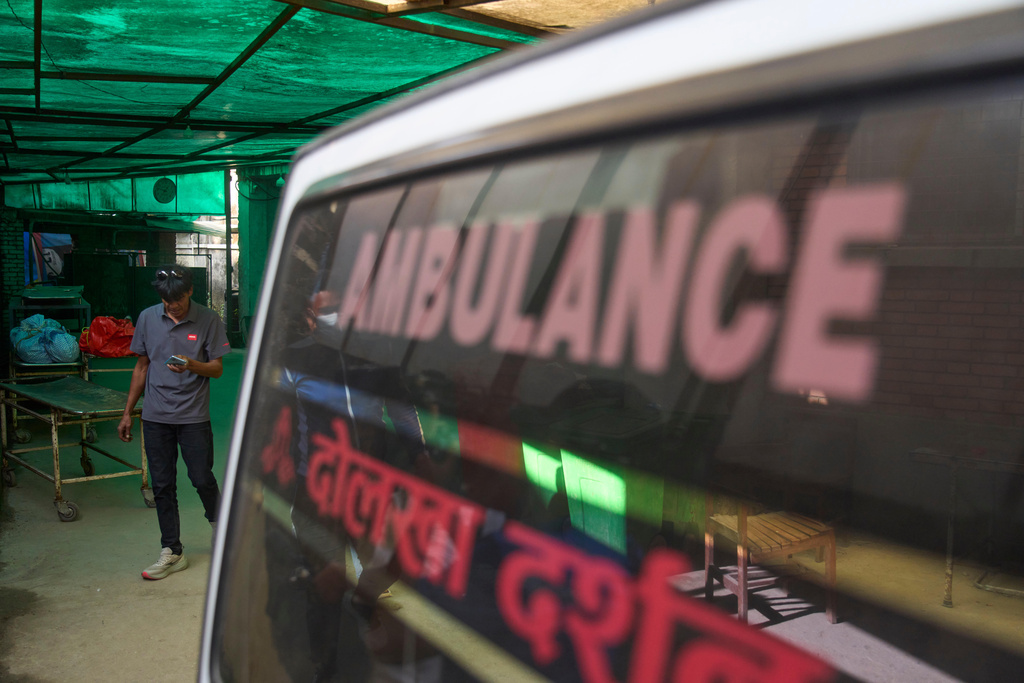 Hospital staff unload the body of a climber killed in an avalanche on Mount Yalung Ri at the morgue of Tribhuvan University Teaching Hospital in Kathmandu, Nepal, Wednesday, Nov. 5, 2025. (AP Photo/Niranjan Shrestha)