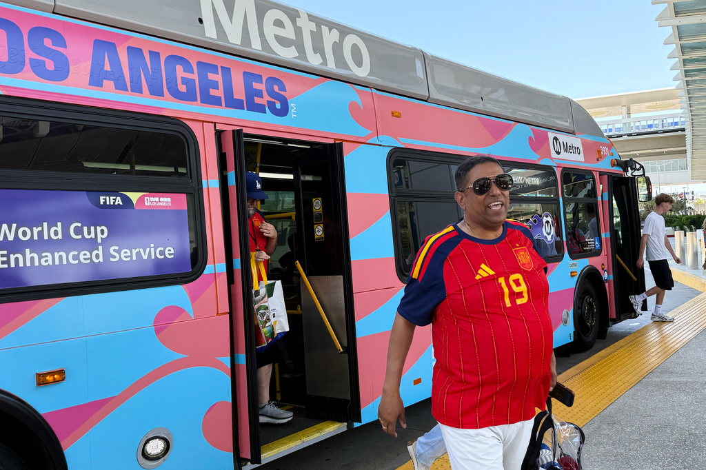 Fans exit a Metro shuttle after a World Cup match between Spain and Austria on Thursday, July 2, 2026, in Los Angeles. (AP Photo/Jaimie Ding)
