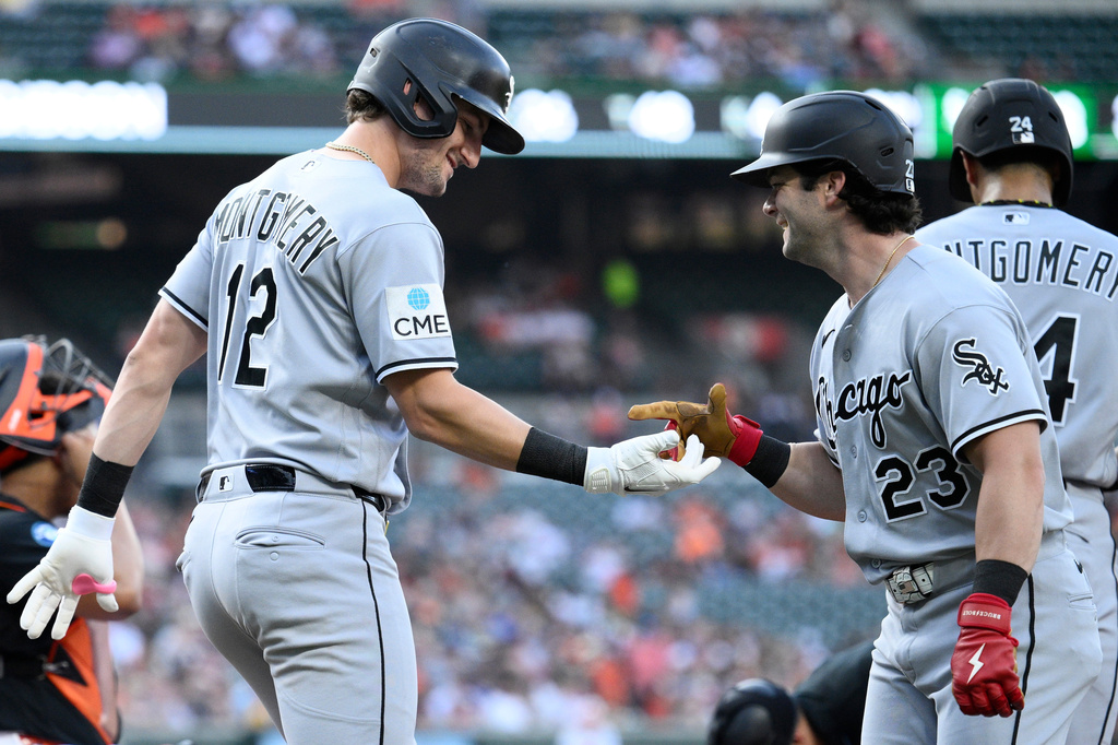 Chicago White Sox's Colson Montgomery (12) celebrates his two-run home run with Andrew Benintendi (23) during the third inning of a baseball game against the Baltimore Orioles, Tuesday, June 30, 2026, in Baltimore. (AP Photo/Nick Wass)