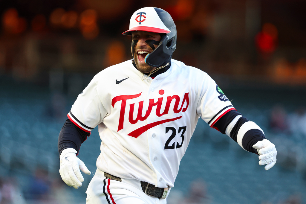 Minnesota Twins' Royce Lewis celebrates after hitting a single to score 2 runs batted in during the first inning of a baseball game against the Detroit Tigers Wednesday, April 8, 2026, in Minneapolis. (AP Photo/Ellen Schmidt)