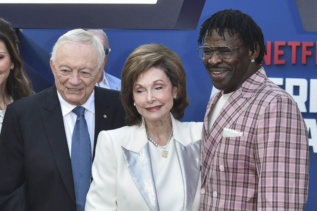 Jerry Jones, from left, Eugenia Jones, and Michael Irvin arrive at the premiere of "America's Team: The Gambler and His Cowboys" on Monday, Aug. 11, 2025, at The Egyptian Theatre in Los Angeles. (Photo by Richard Shotwell/Invision/AP)