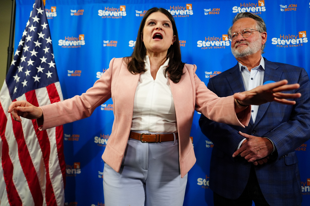 Rep. Haley Stevens, D-Mich., left, a candidate in the Democratic primary for U.S. Senate in Michigan, accompanied by Sen. Gary Peters, D-Mich., speaks during a campaign event at the UA Local Plumbers 98 Union Hall, Sunday, Aug. 2, 2026, in Madison Heights, Mich. (AP Photo/Julia Demaree Nikhinson)