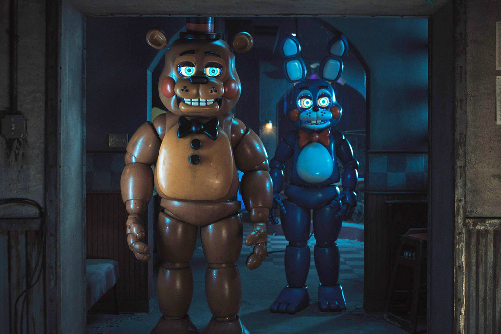 This image released by Universal Pictures shows Toy Freddy, voiced by Kellen Goff, left, and Toy Bonnie, voiced by Matthew Patrick, in a scene from "Five Nights at Freddy's 2." (Ryan Green/Universal Pictures via AP)